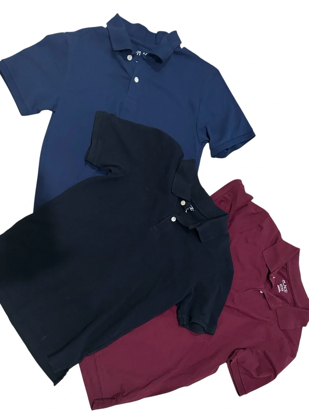 Three Polo Shirts in Navy, Black, and Burgundy